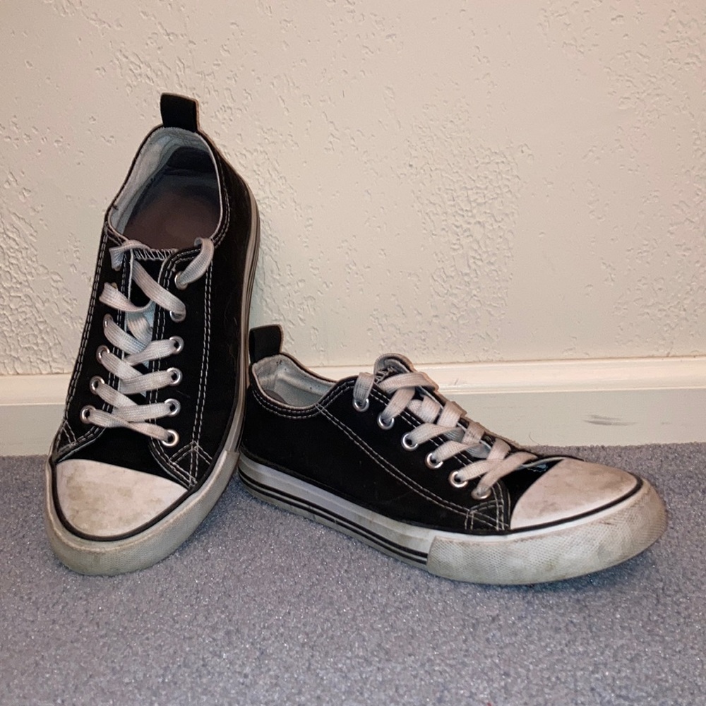 Canvas sneakers, black and white. No branding.